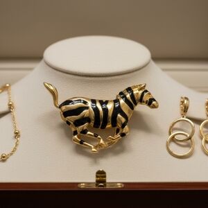 Elegant Gold and Black Zebra Brooch